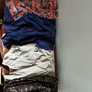 Four (4) pairs of brand new Eddie Bauer athletic shorts.